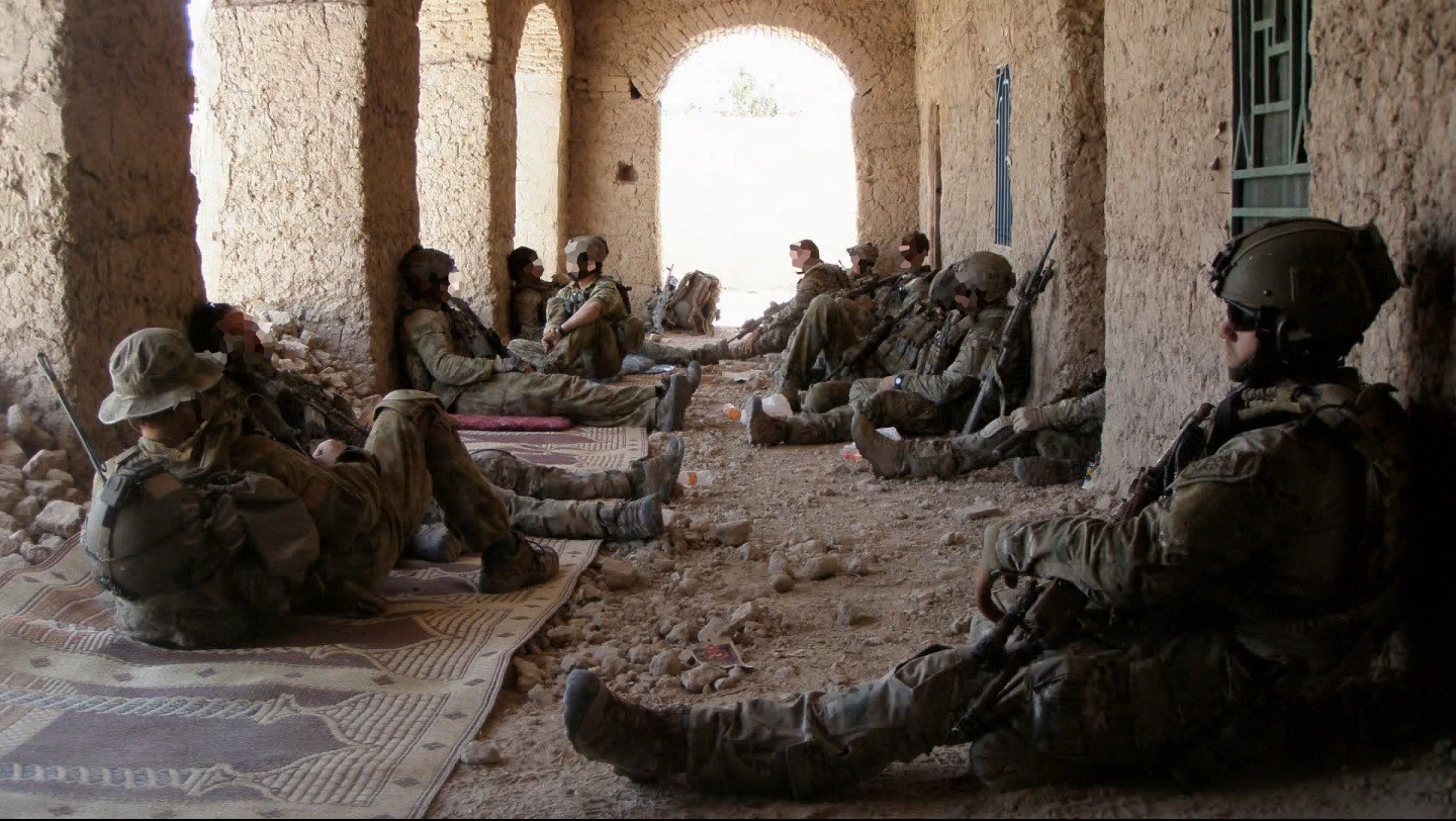 SGT Brett Wood (front, right) rests with his platoon during operations in Afghanistan