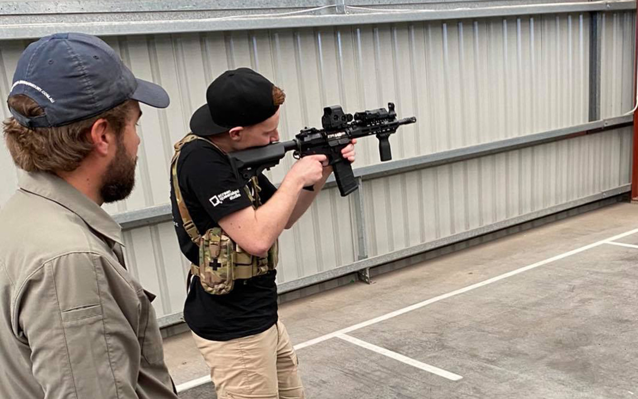 Screen Combat Safety student firing AR-15