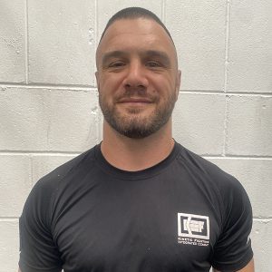 Army veteran and Kinetic Fighting Instructor Simon Mouatt in KEF–IC Instructor T-shirt