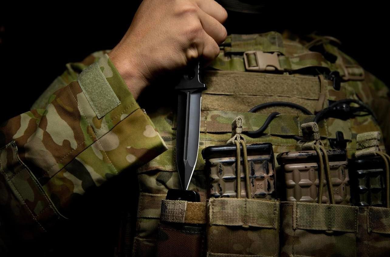 Australian soldier carrying clearing knife